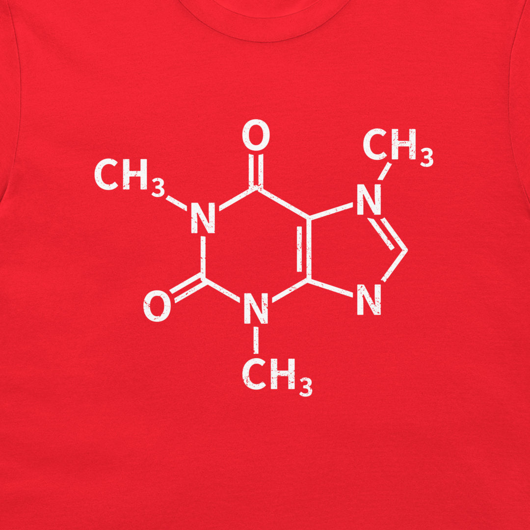 A close-up of a caffeine molecule structure graphic printed on a red T-shirt