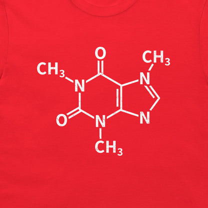 A close-up of a caffeine molecule structure graphic printed on a red T-shirt