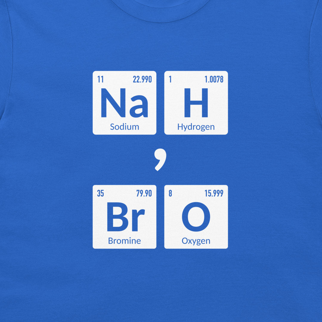 A close-up of a royal blue t-shirt featuring a graphic print of four white periodic table style tiles spelling out 'Na H Br O' separated by a white semicolon symbol.