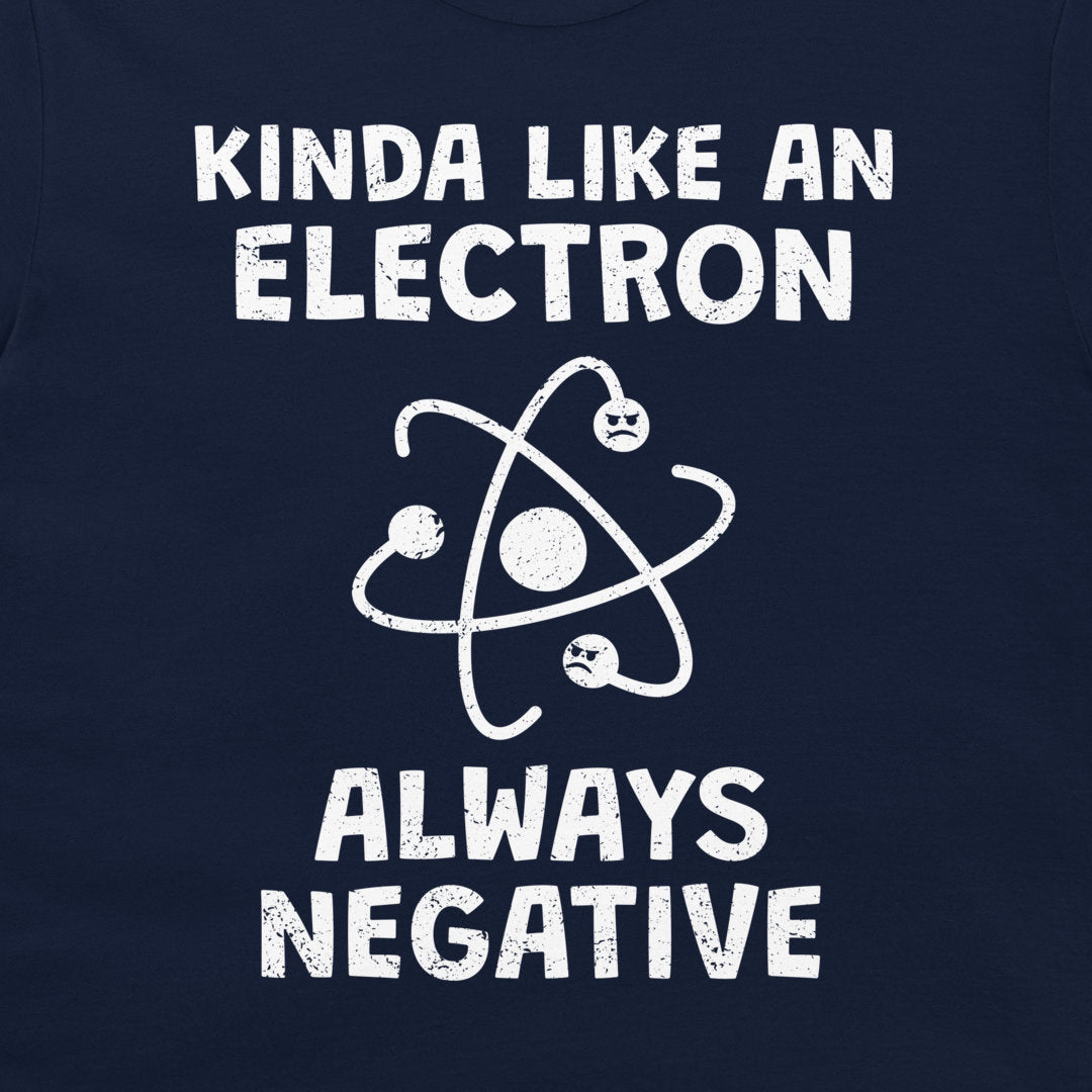 A close-up of a navy blue shirt or fabric featuring a white distressed graphic that reads 'KINDA LIKE AN ELECTRON ALWAYS NEGATIVE' with an atom symbol and small sad electrons
