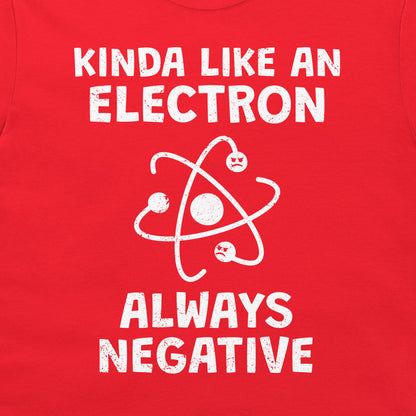 A close-up of a bright red t-shirt, featuring a white distressed graphic print that reads 'KINDA LIKE AN ELECTRON ALWAYS NEGATIVE' with an atom symbol.