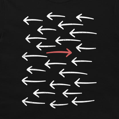 A black t-shirt featuring a graphic print of multiple white distressed arrows pointing left, with one central arrow pointing right in red.
