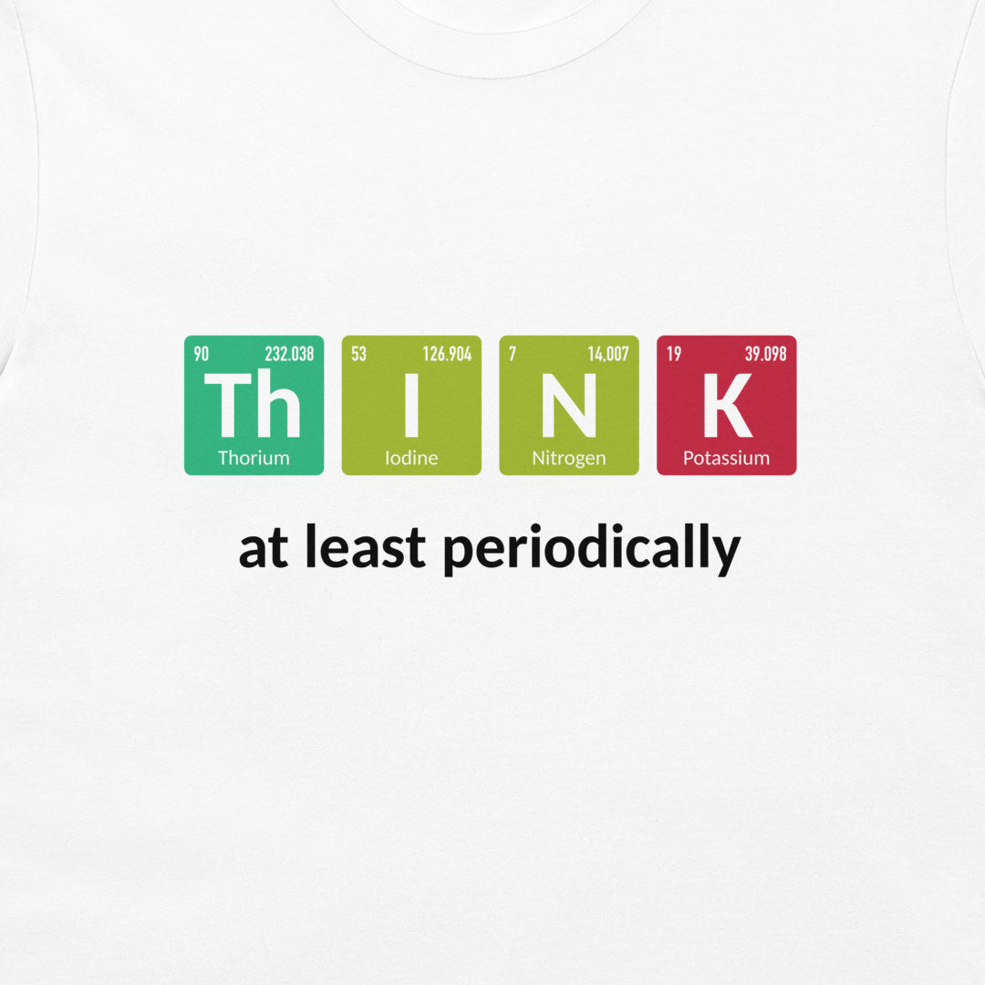 A white crewneck t-shirt featuring a graphic design that spells out 'THINK' using periodic table element tiles in green, yellow-green, and red, with the phrase 'at least periodically' printed below in black.