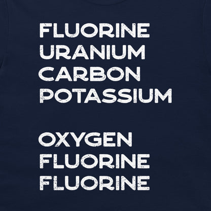 Close-up of the hidden element-name message printed in white on a navy science T-shirt
