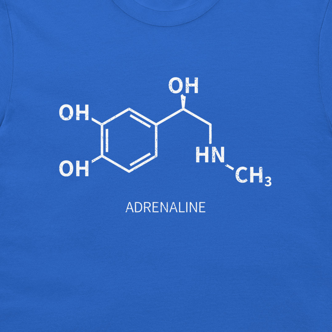 Close-up of white adrenaline chemical structure on a royal blue T-shirt
