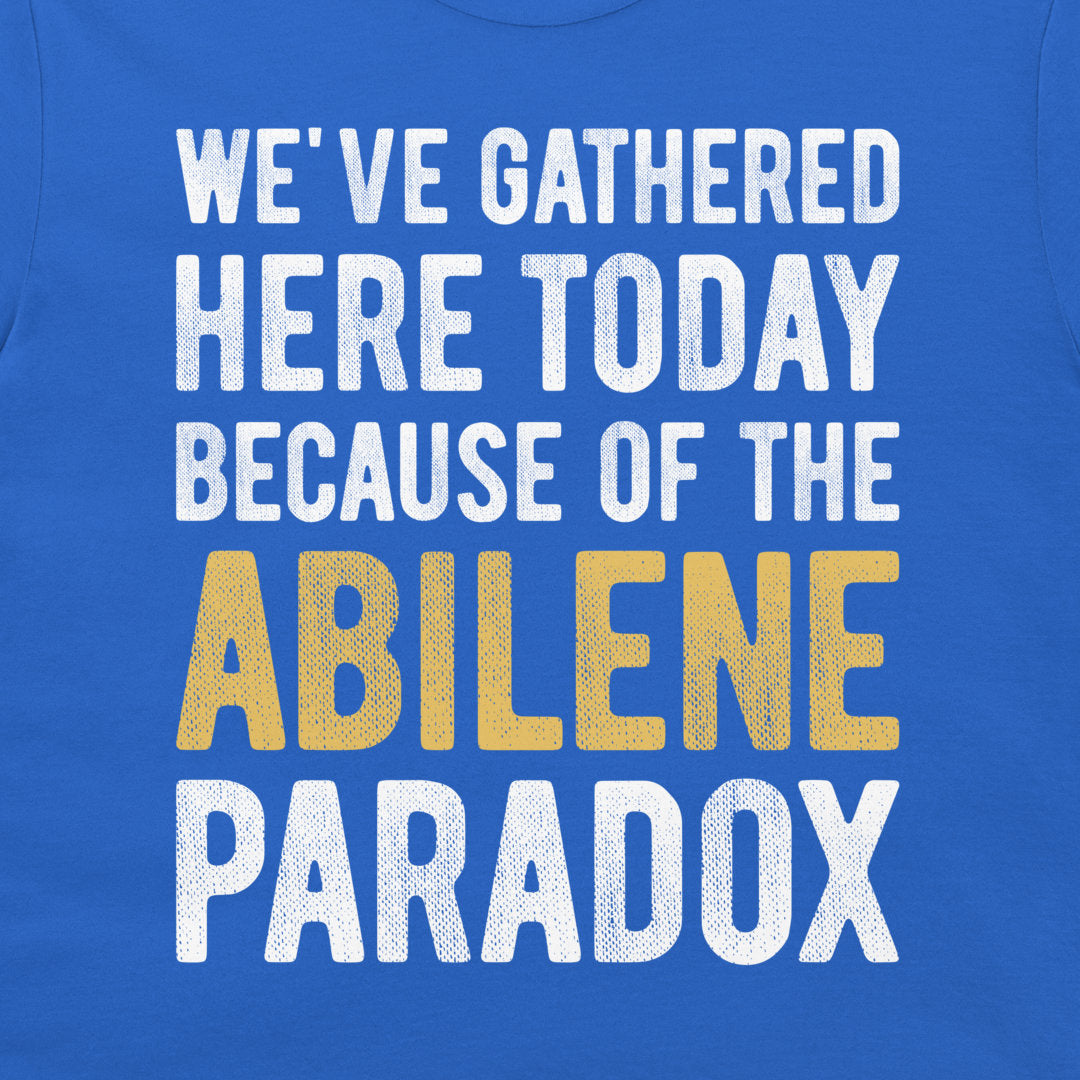 Close-up of Abilene Paradox psychology joke design on a royal blue T-shirt