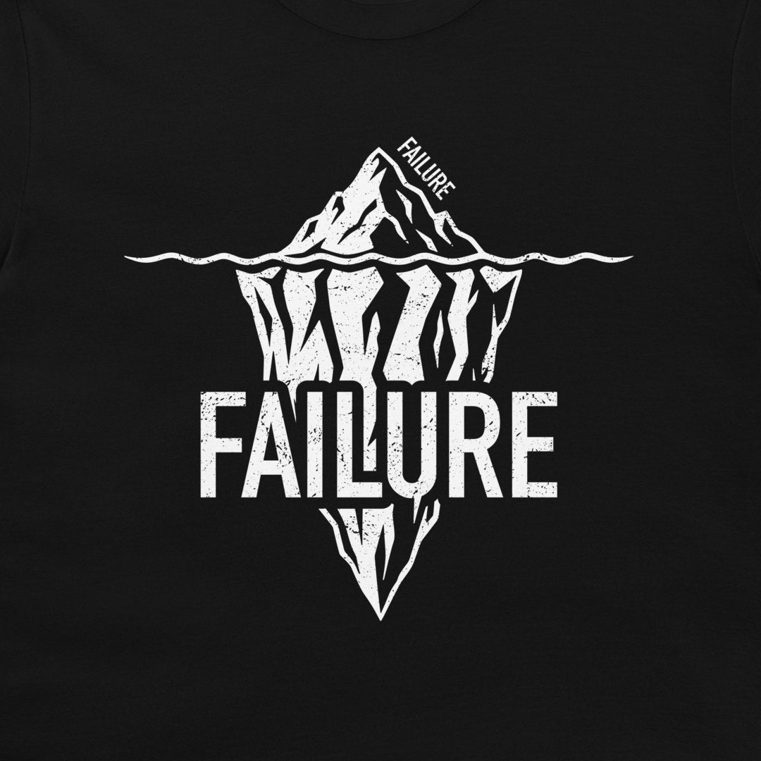 Close-up of white Failure iceberg design printed on a black T-shirt