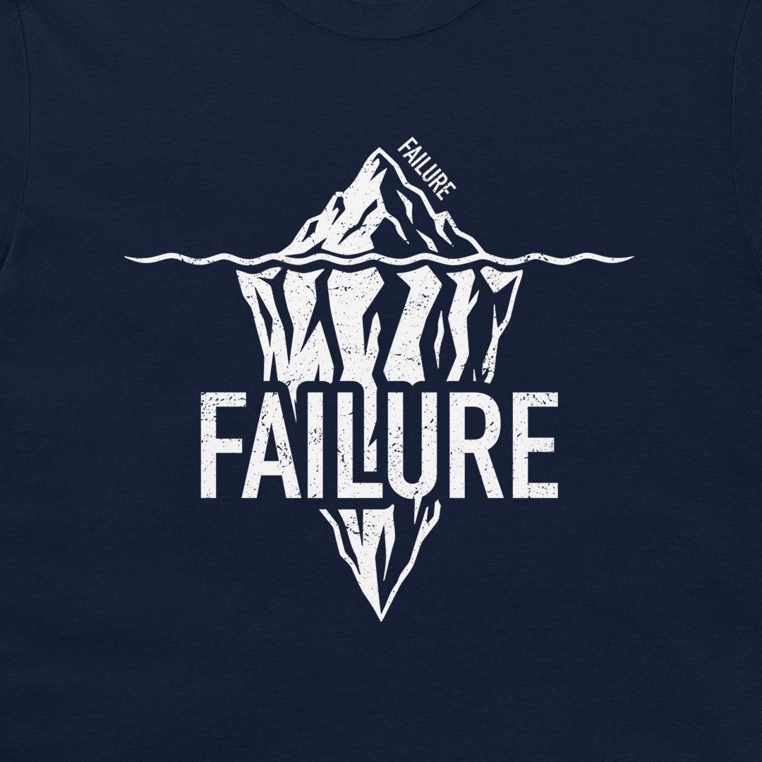 Close-up of white Failure iceberg design printed on a navy T-shirt