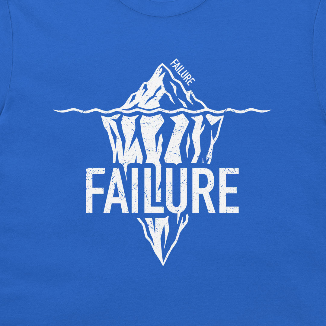 Close-up of white Failure iceberg graphic printed on a royal blue T-shirt