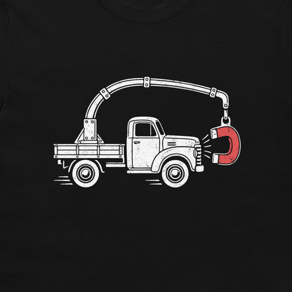 Close-up of the perpetual motion truck and red magnet graphic on a black T-shirt