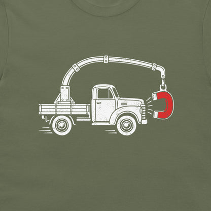 Close-up of the perpetual motion truck and red magnet graphic on a military green T-shirt
