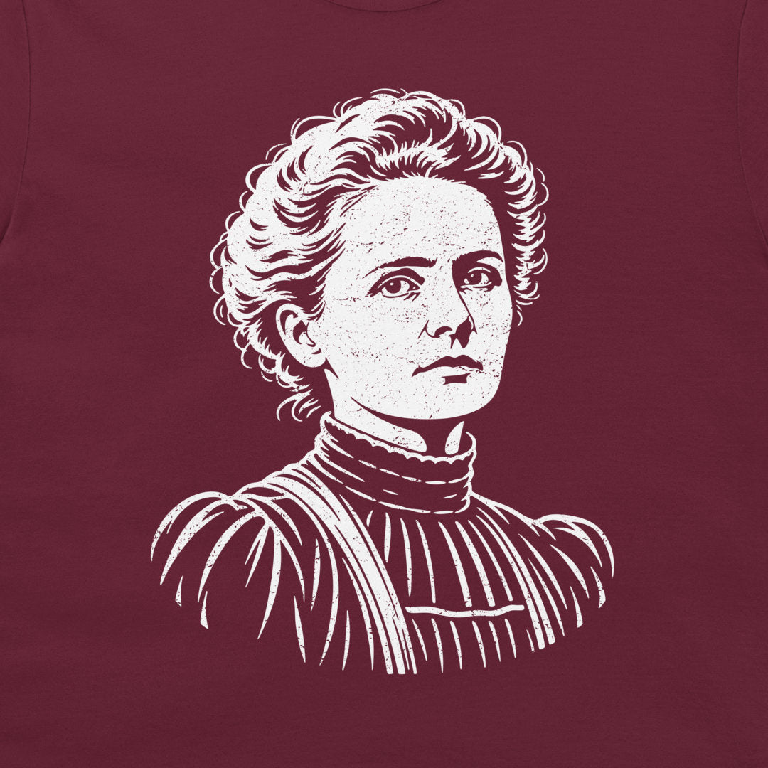 Close-up of the white Marie Curie portrait on a Maroon T-shirt.