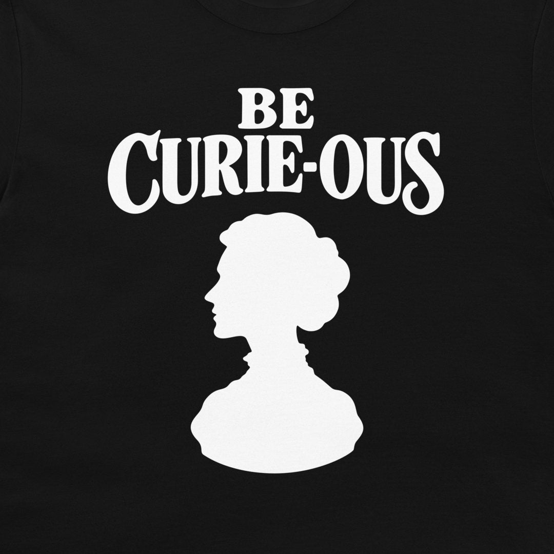 Close-up of the white Be Curie-ous design on a black T-shirt.