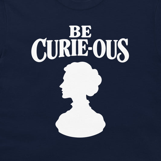 Close-up of the white Be Curie-ous design on a navy T-shirt.