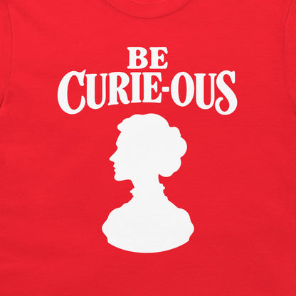 Close-up of the white Be Curie-ous design on a red T-shirt.