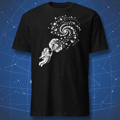 Black T-shirt with an astronaut blowing dandelion seeds that swirl into a spiral galaxy.