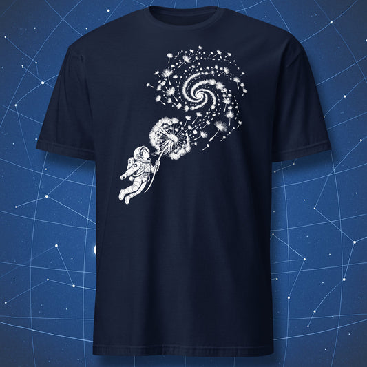 Navy T-shirt with an astronaut blowing a dandelion whose seeds form a spiral galaxy.