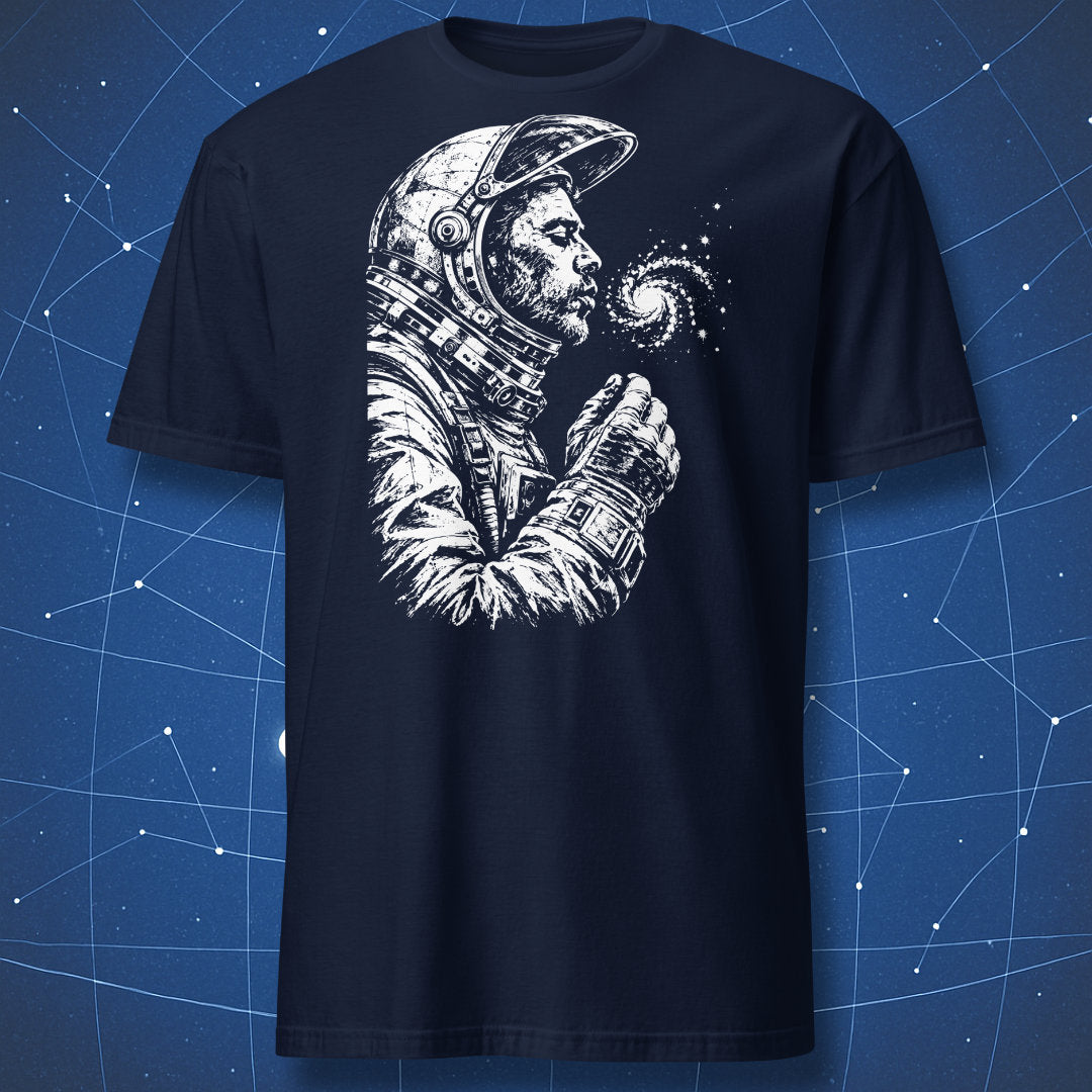 Navy T-shirt with a white astronaut blowing stars from a spiral galaxy.