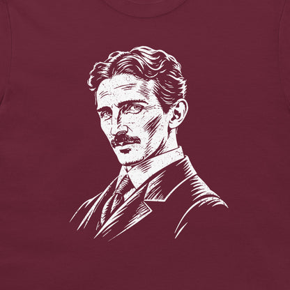 Close-up of the white Nikola Tesla portrait on a maroon T-shirt