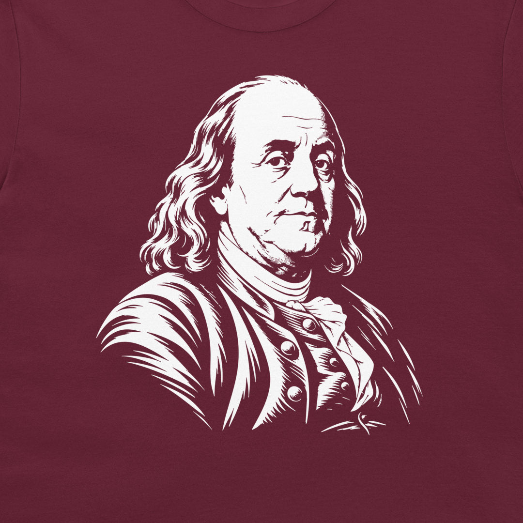 Close-up of the Benjamin Franklin portrait on a maroon T-shirt