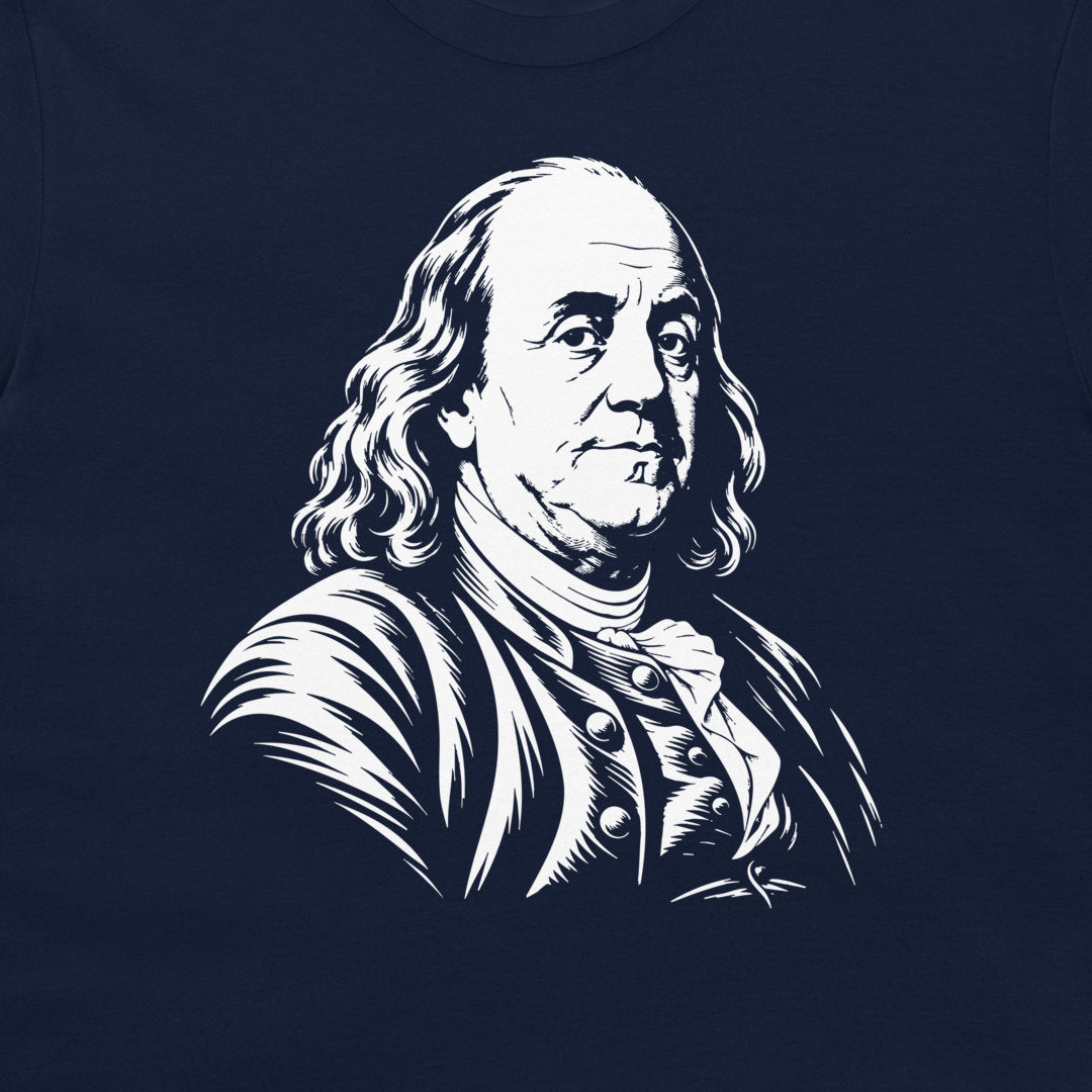 Close-up of the Benjamin Franklin portrait on a navy T-shirt