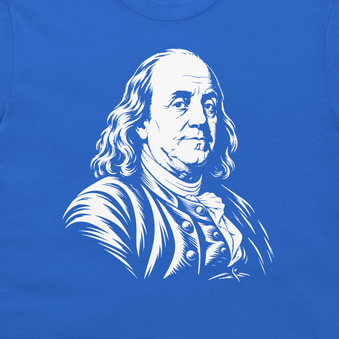 Close-up of the Benjamin Franklin portrait on a royal blue T-shirt