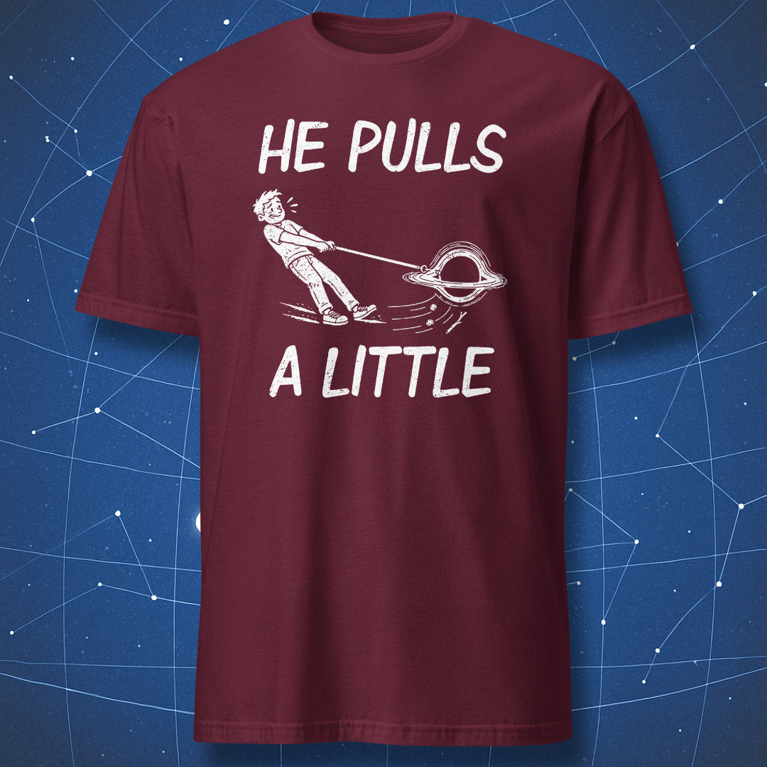 Maroon He Pulls a Little T-shirt with a white cartoon of a black hole pulling its owner along on a leash.