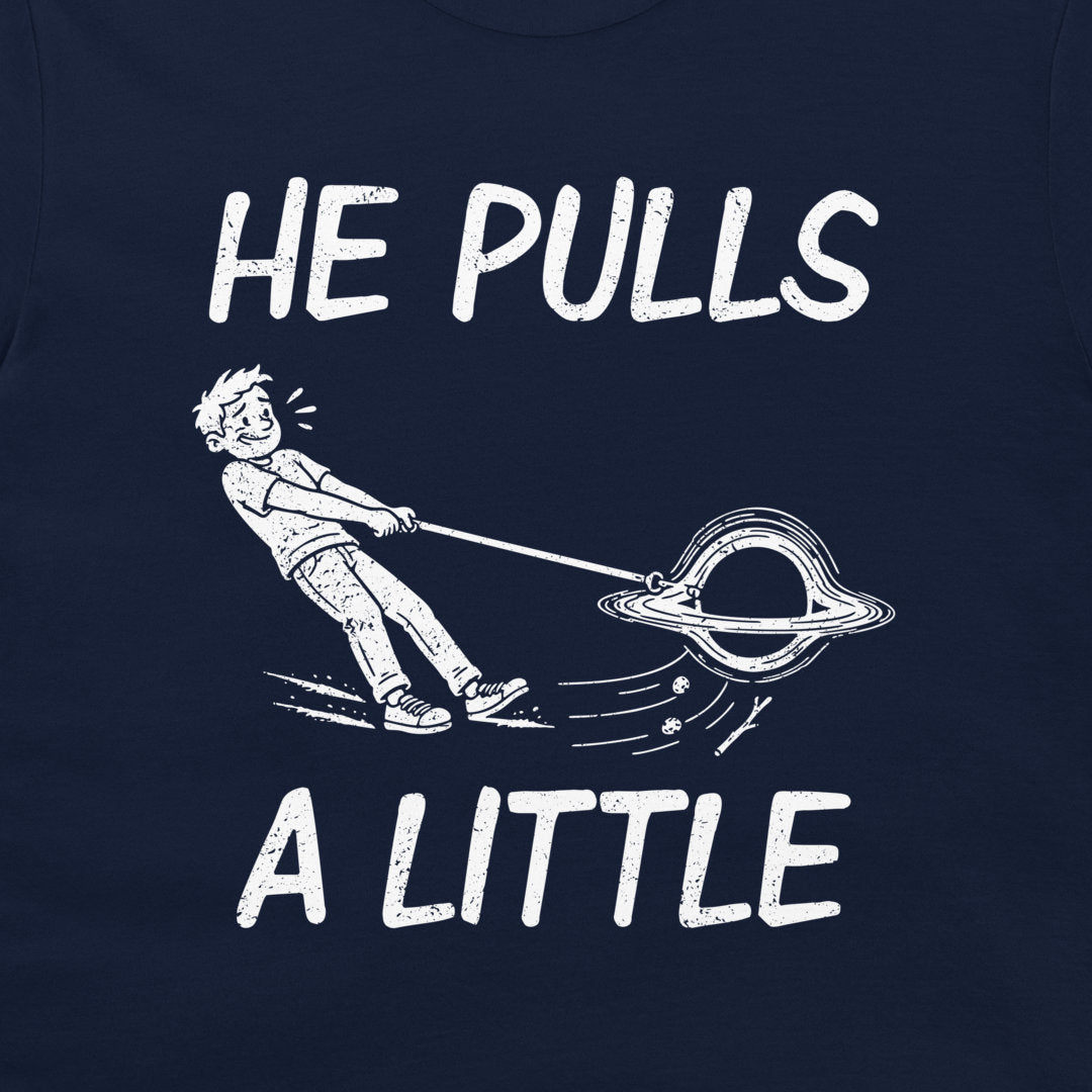 Close-up of the white black-hole cartoon and He Pulls a Little lettering printed on navy fabric.