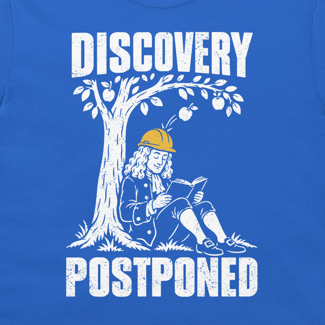 Detail of the distressed white Newton illustration, yellow safety helmet, and Discovery Postponed lettering on royal blue fabric.