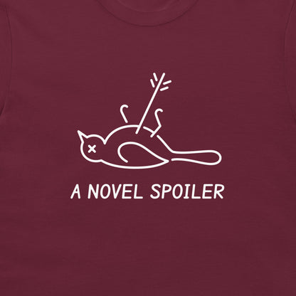Close-up of the white dead mockingbird graphic and “A NOVEL SPOILER” caption on a maroon T-shirt.