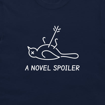 Close-up of the minimalist bird with an X eye, an arrow, and “A NOVEL SPOILER” lettering on navy fabric.