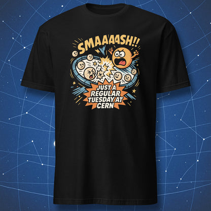 Black T-shirt with comic-style atoms colliding and text “SMAAASH!! Just a regular Tuesday at CERN” — funny particle physics humor shirt.