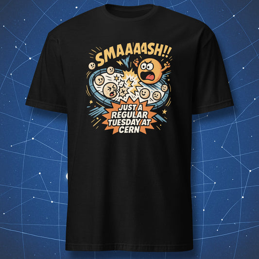 Black T-shirt with comic-style atoms colliding and text “SMAAASH!! Just a regular Tuesday at CERN” — funny particle physics humor shirt.