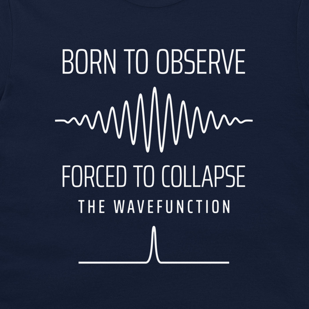 Close-up of the quantum wave packet and collapsed state graphic on a navy T-shirt