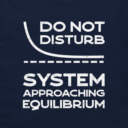 Close-up of the distressed white equilibrium relaxation curve design on a navy T-shirt