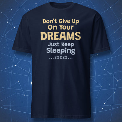 Navy T-shirt with distressed “Don't Give Up On Your Dreams – Just Keep Sleeping” typography.