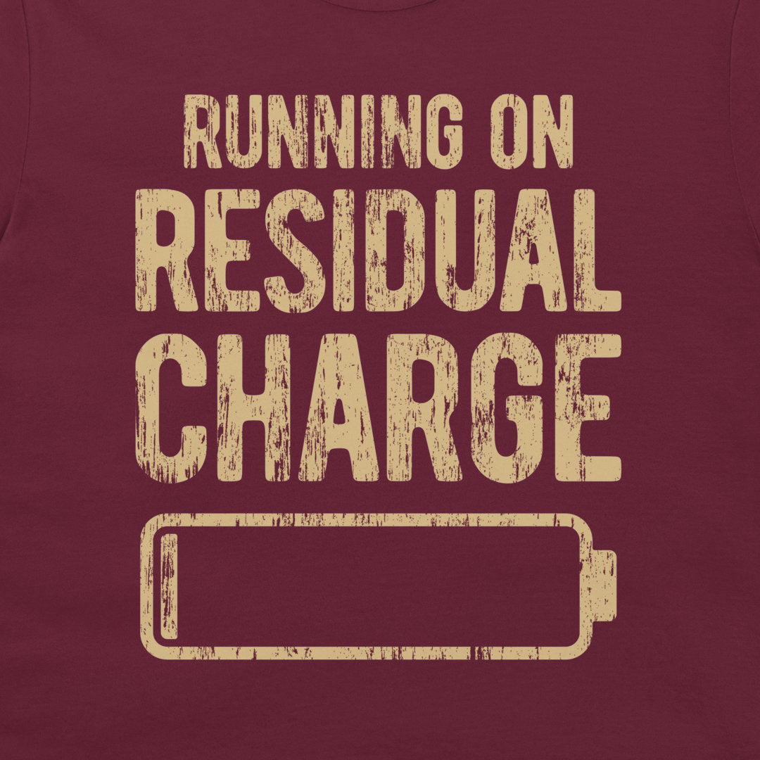 Close-up of the residual charge battery design printed on a maroon T-shirt