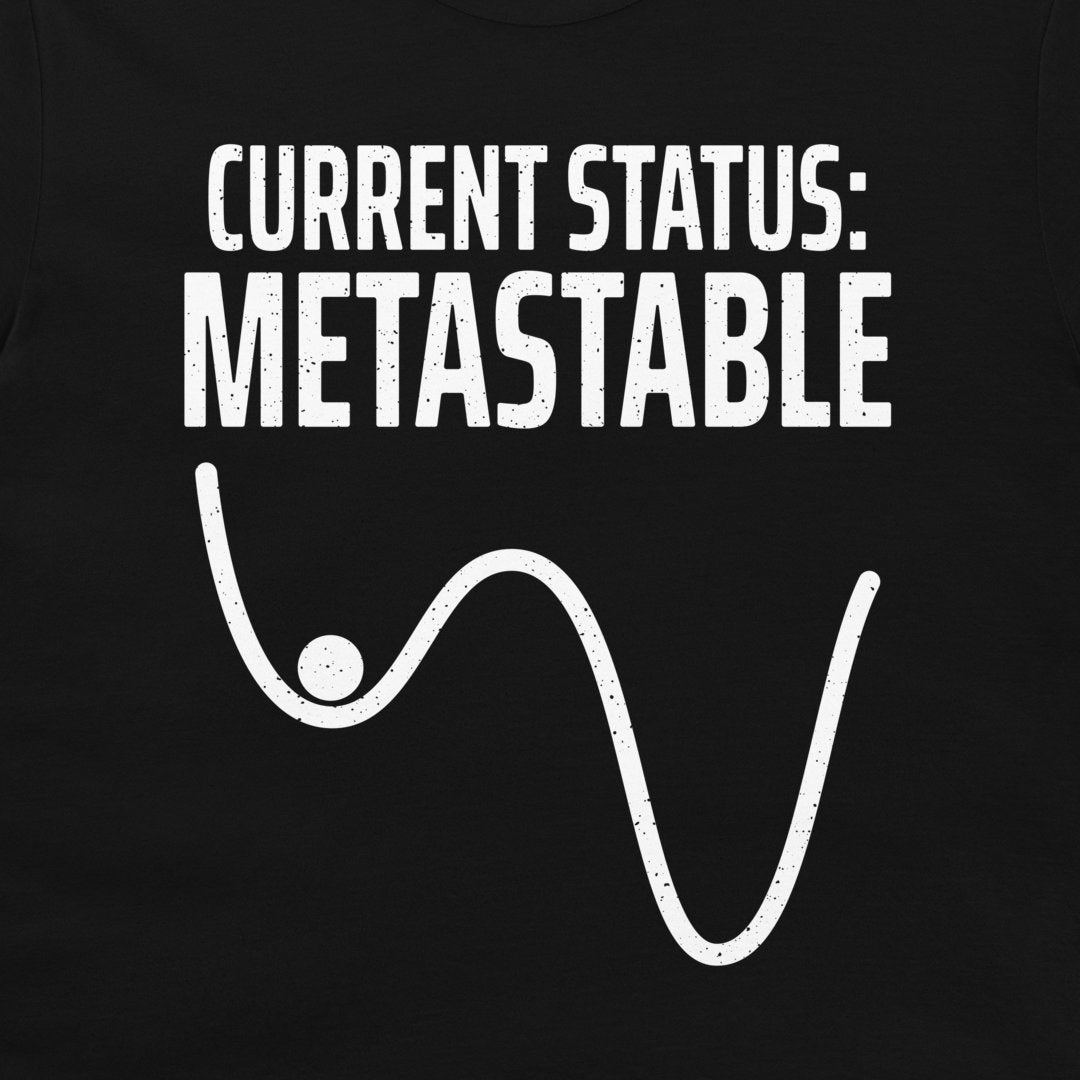 Close-up of the Current Status Metastable physics design on a black T-shirt