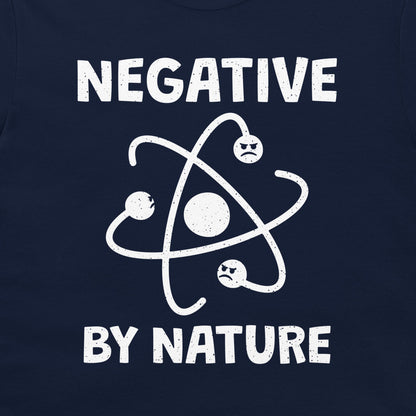Close-up of the grumpy atom physics design on a navy T-shirt