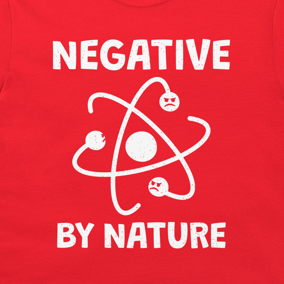 Close-up of the funny atom and negative electrons design on a red T-shirt