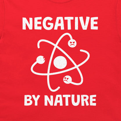 Close-up of the funny atom and negative electrons design on a red T-shirt