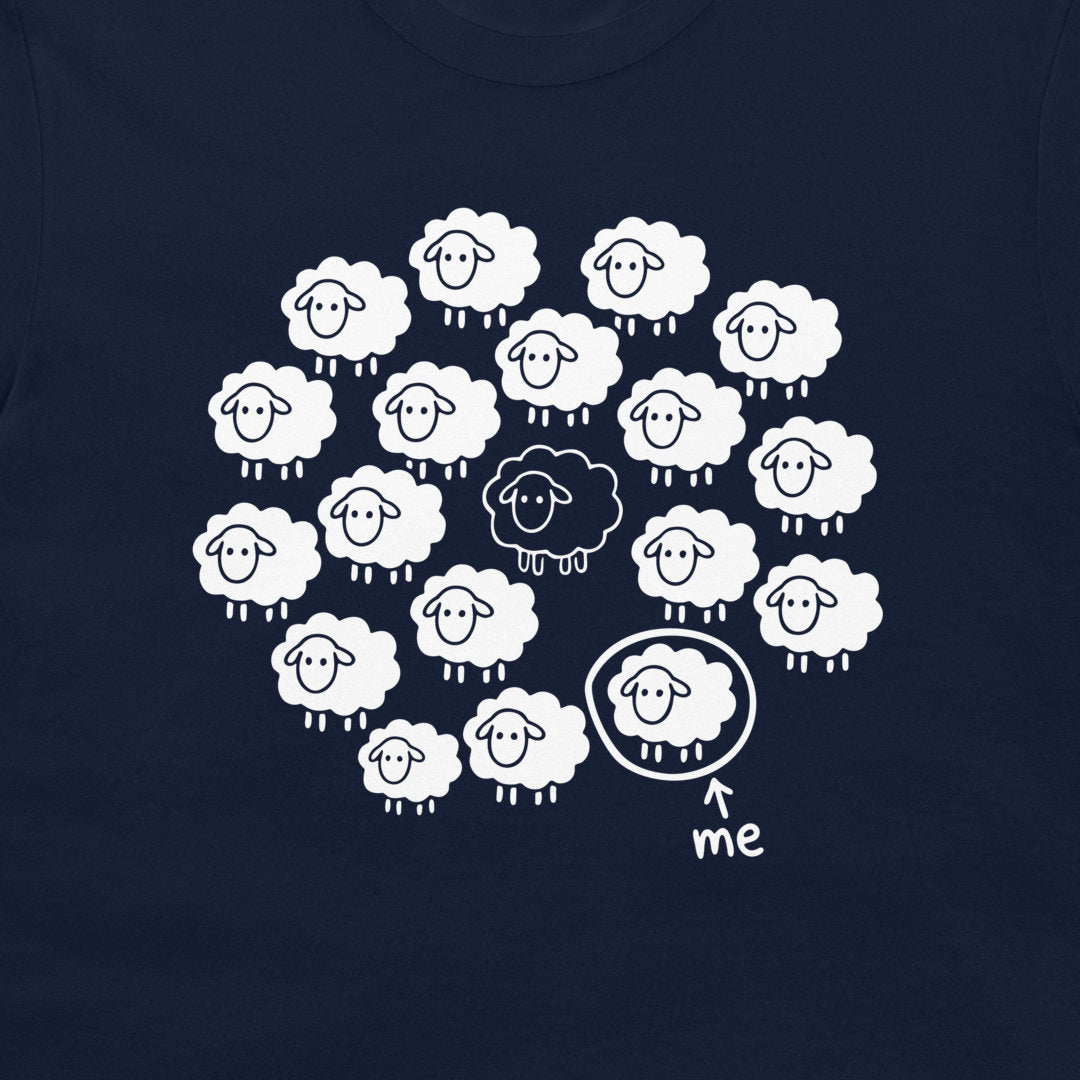 Close-up of the Not the Black Sheep funny sheep design printed on a navy T-shirt