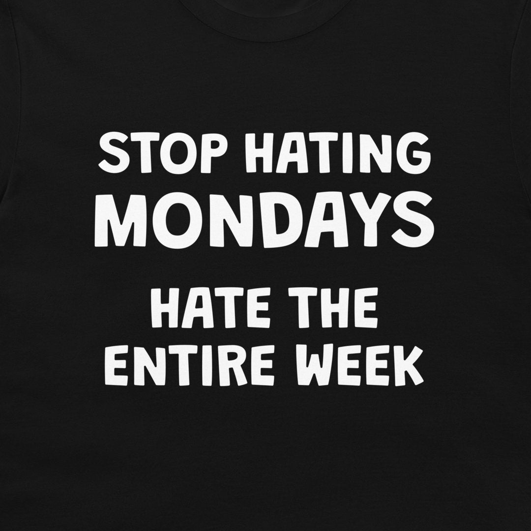 Close-up of Stop Hating Mondays Hate the Entire Week design on black T-shirt