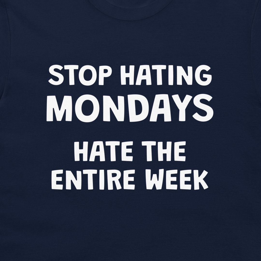 Close-up of funny Stop Hating Mondays quote printed on navy T-shirt