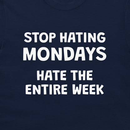 Close-up of funny Stop Hating Mondays quote printed on navy T-shirt